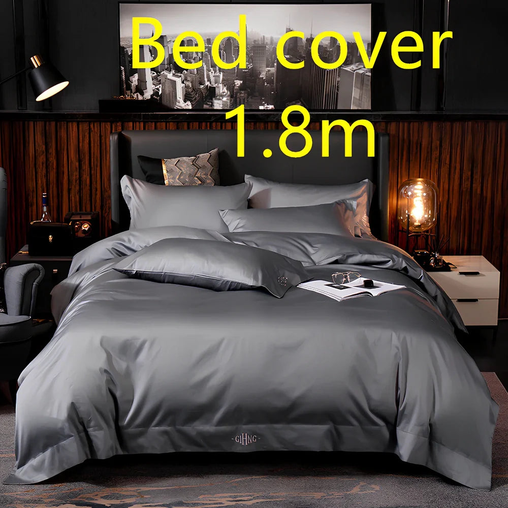 Four-piece quilted cotton bed set in royal blue, showing 200x230 cm cover and 48x74 cm pillowcases for 1.5m bed