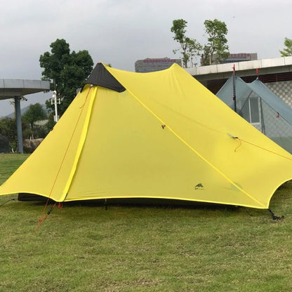 Single tip poleless tent with aluminium supports and camouflage design in outdoor setting