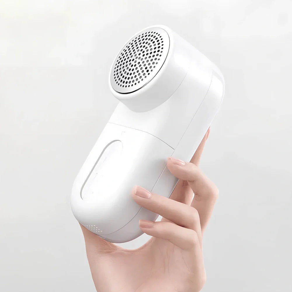 White plastic electric shaver with bulb removal function measuring 145mm length