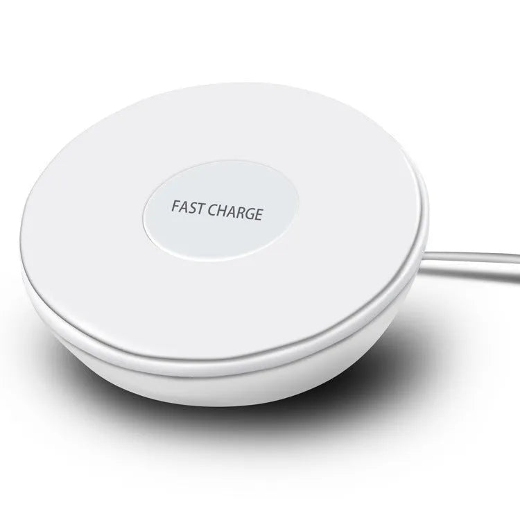 White 10W QI wireless charging pad with digital clock display and night light on a wooden surface.