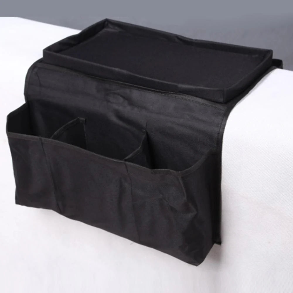 Sofa arm organizer bag in black with multiple pockets for remote controls and magazines