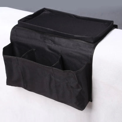 Sofa arm organizer bag in black with multiple pockets for remote controls and magazines