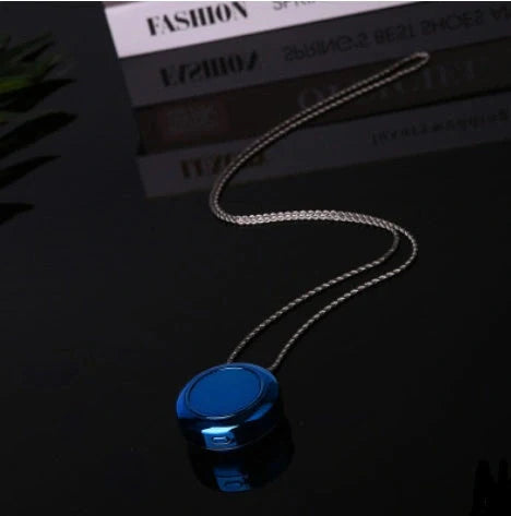 Portable negative ion air purifier necklace in blue, white, and silver