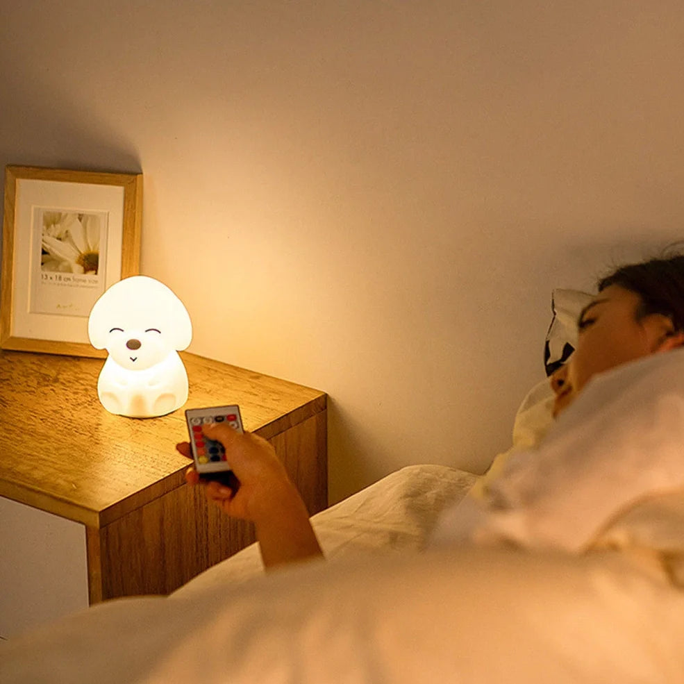 White silicone dog shaped table lamp with touch sensitive nose and colourful LED illumination