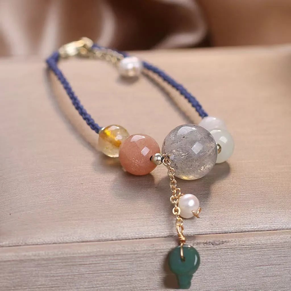 Hand-woven women's bracelet with adjustable buckle in red, green or blue with crystal and sequin details