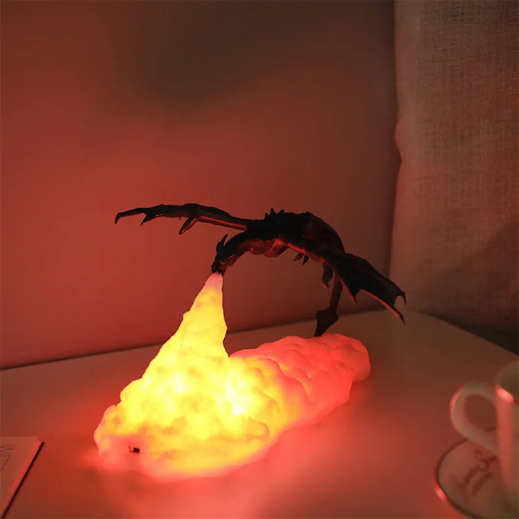3D printed fire-breathing dragon night light with warm red LED illumination on dark surface