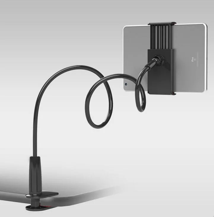 Bedside oversize flat panel handset with long arm holding a mobile phone on a table