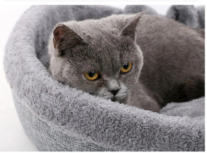 Cozy heart-shaped pet bed in grey and pink colors, suitable for cats and small dogs
