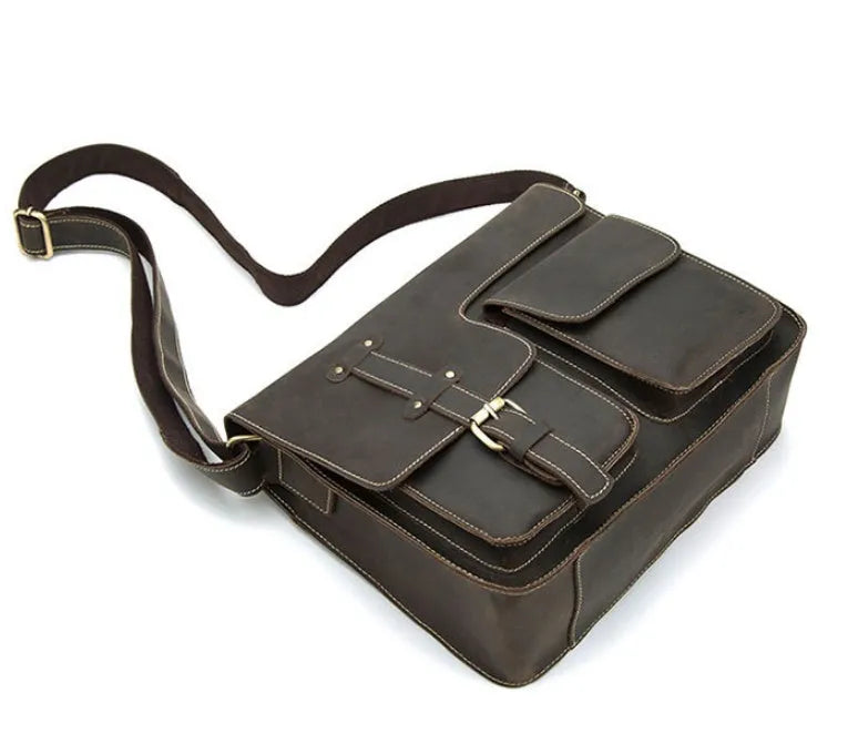 Leather vintage messenger bag in black with adjustable crossbody strap and brass buckle