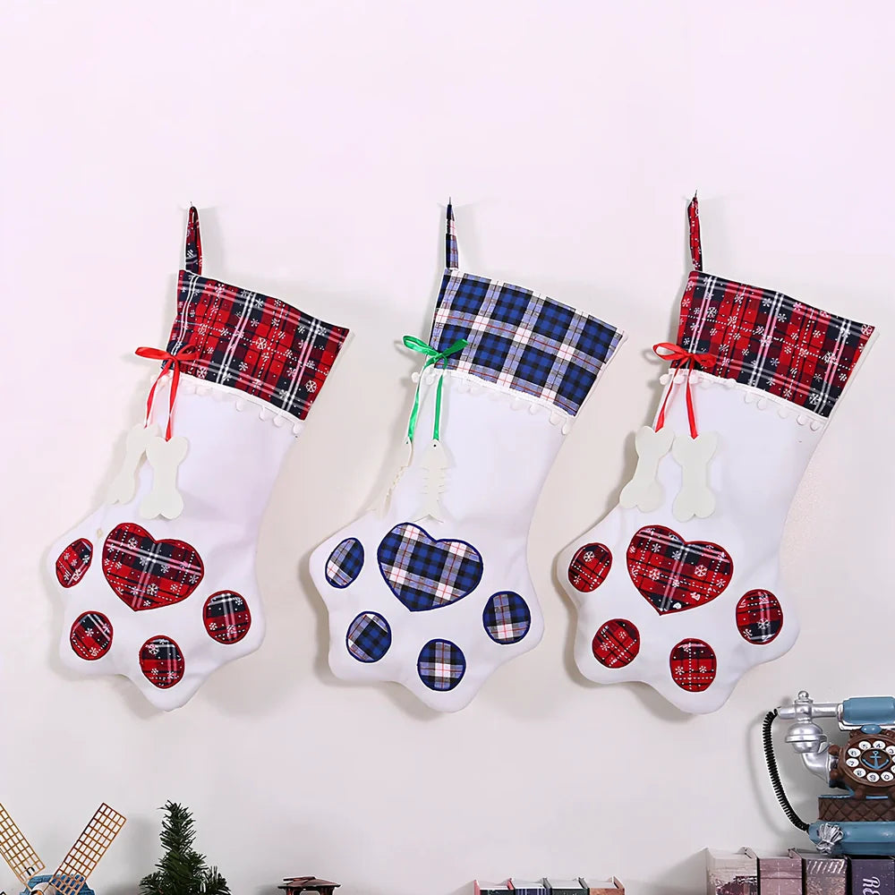 Red dog paw shaped Christmas stocking measuring 20cm by 46cm with reinforced hanging loop