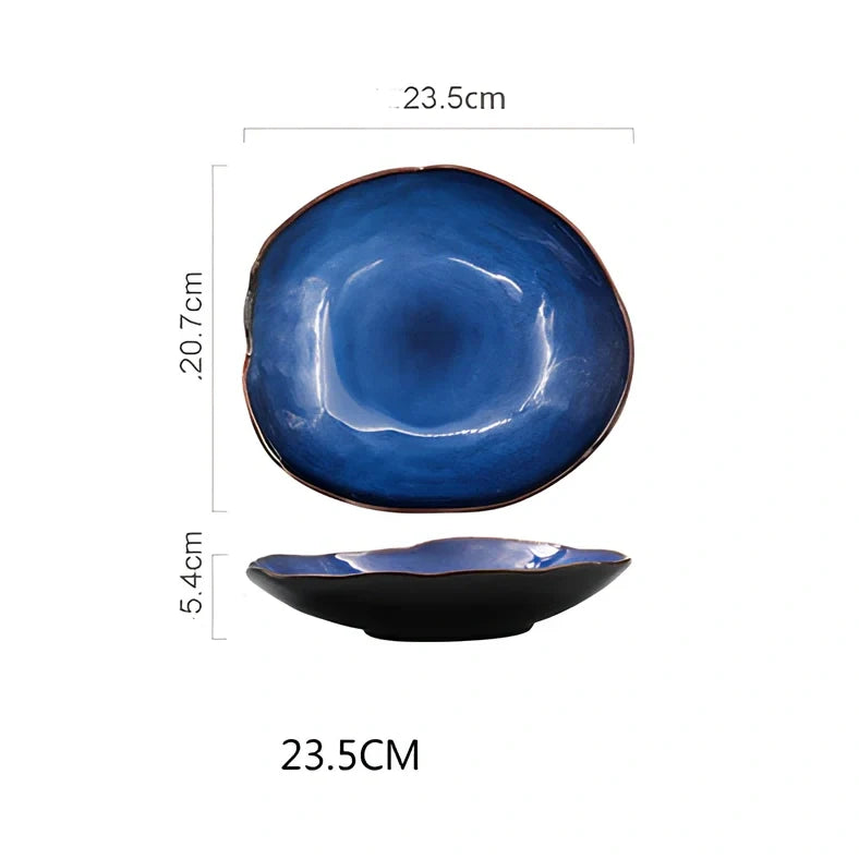 Blue irregular ceramic plate with kiln-changing glaze pattern, measuring approximately 20cm across irregular edges