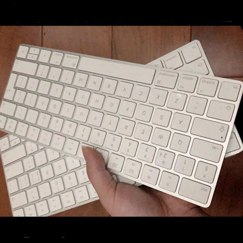 White Apple G6 ultra-thin metal Bluetooth wireless keyboard on a desk
