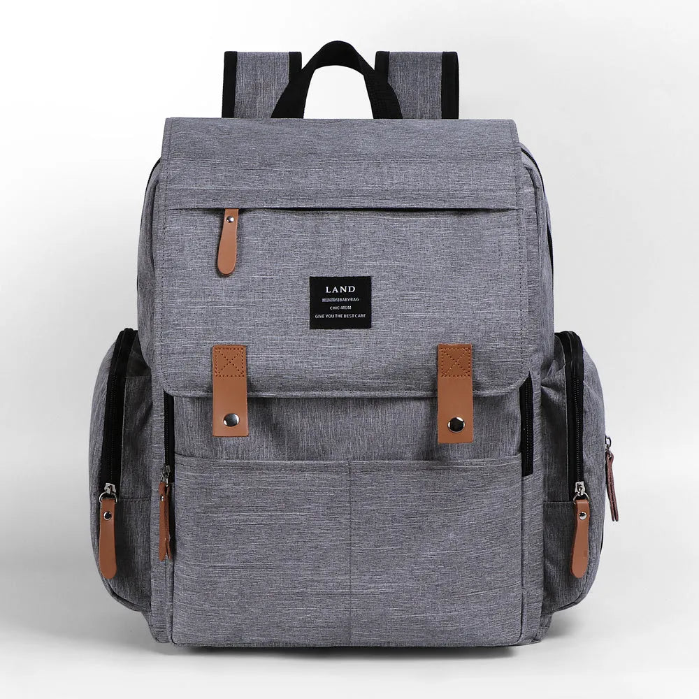 LAND Mommy large grey diaper backpack with changing mat, shown as a travel nappy bag.