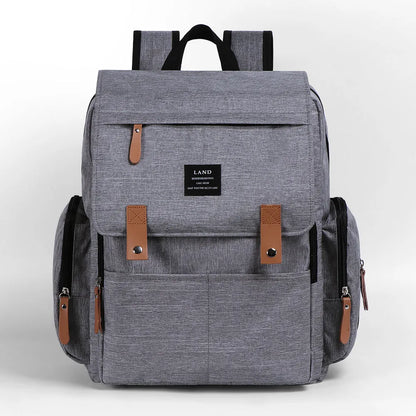 LAND Mommy large grey diaper backpack with changing mat, shown as a travel nappy bag.