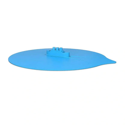 Blue silicone steamer lid measuring 26x25cm on kitchen bowl creating airtight seal for cooking