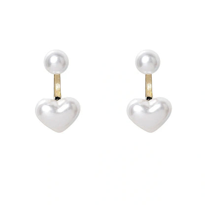 Elegant heart-shaped pearl stud earrings for women, perfect for gifts or personal style.