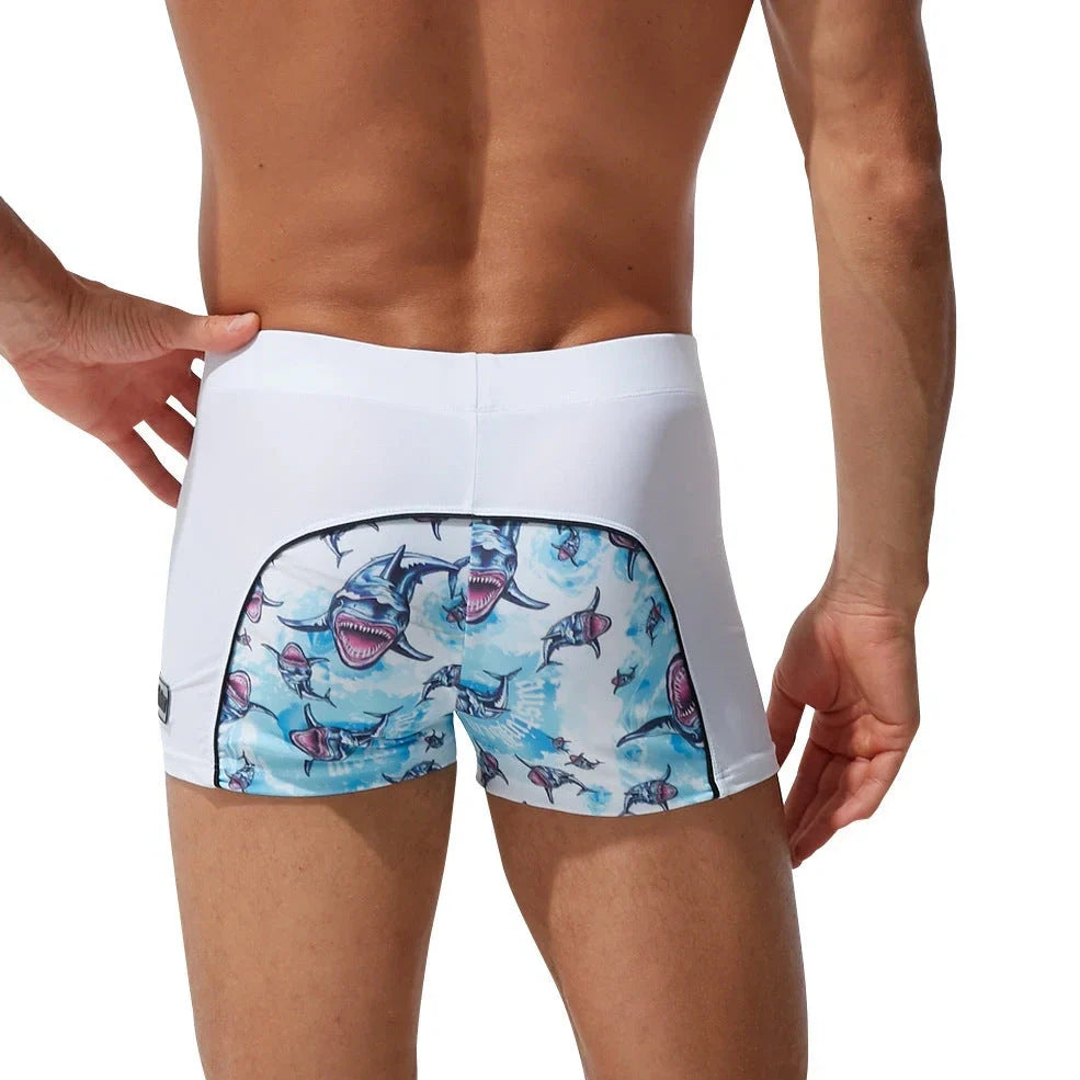 Men's nylon boxer shorts with floral and shark print designs showing deep purple, light purple, multicoloured options