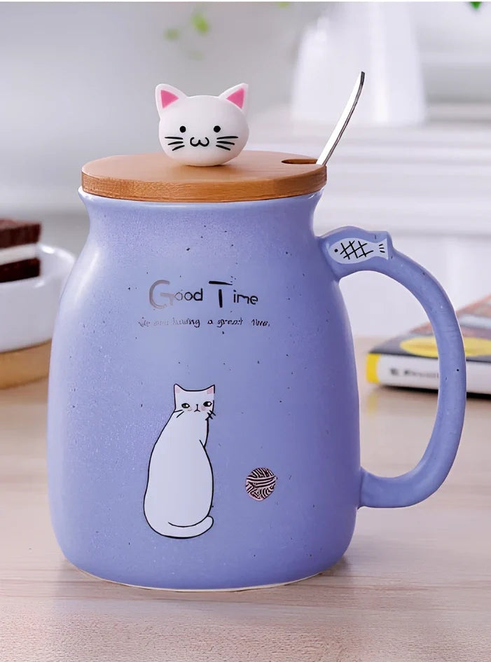 Pink ceramic mug with cartoon cat design, wooden lid, and stainless steel spoon on table