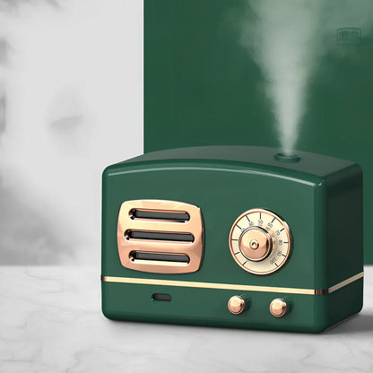 Green retro humidifier with bronzing finish measuring 9.5cm tall on wooden desk