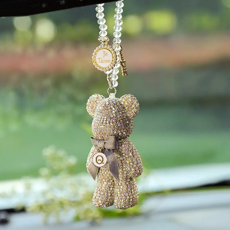 White artificial crystal rhinestone violent bear car rearview mirror pendant measuring 5x9cm.