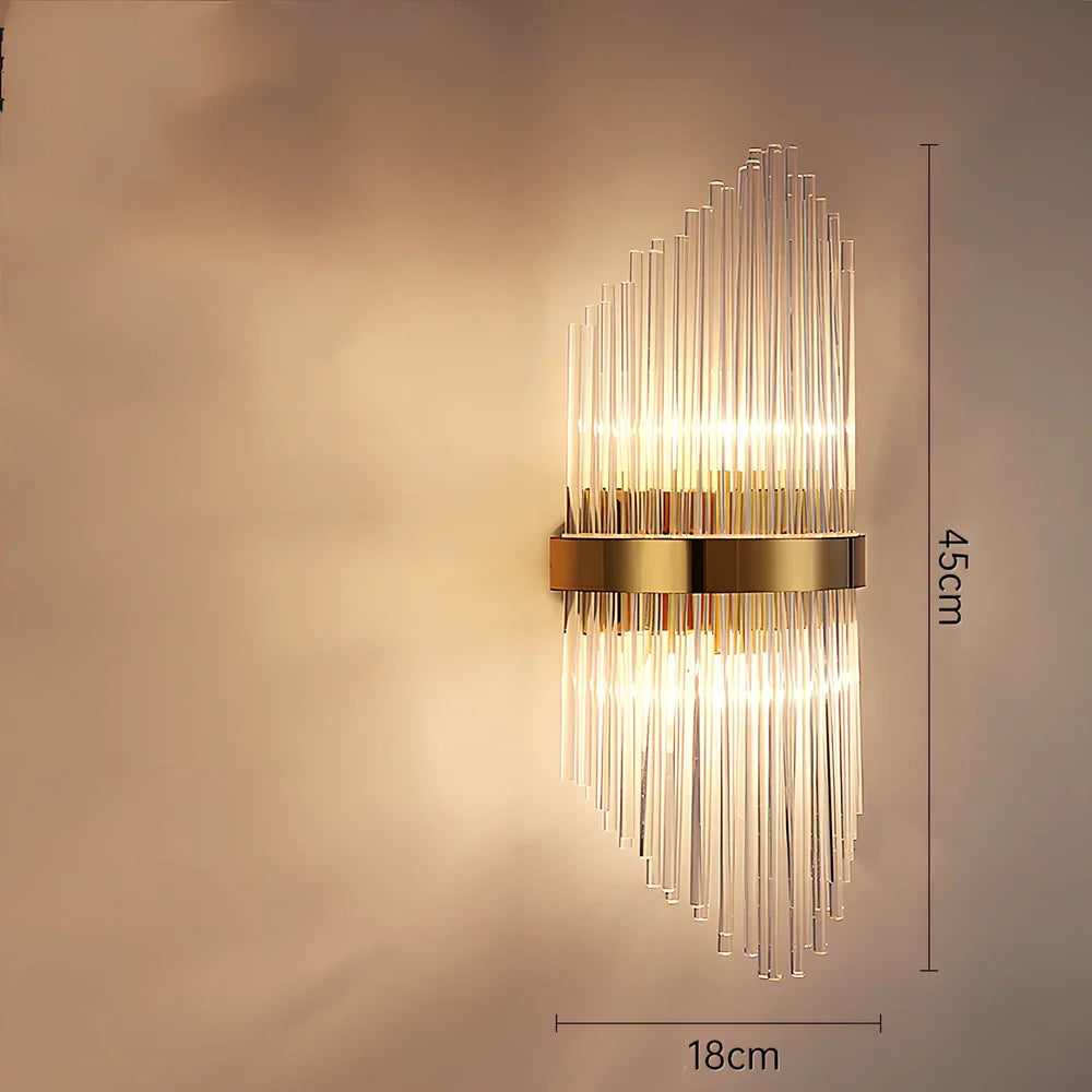 Crystal bedside lamp with stainless steel base and transparent shade providing soft illumination