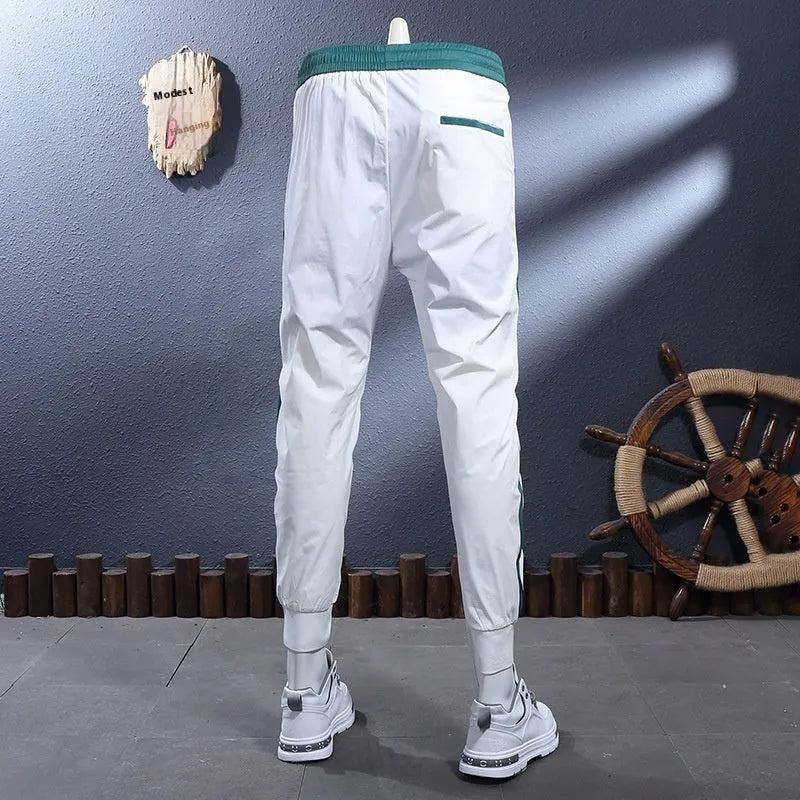 Ice Silk Breathable Stretch Slim-Fitting Ankle-Tied Skinny Sports Pants for Men, Striped Tapered Trousers with Mid Waist and Micro Elasticity, Thin Summer Leisure Street Fashion, White or Black