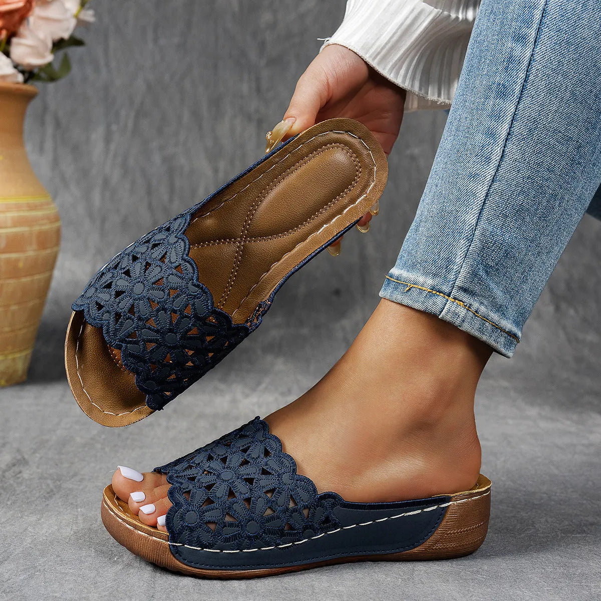 Women's black wedge beach slippers with flower cutout decoration on the PVC upper