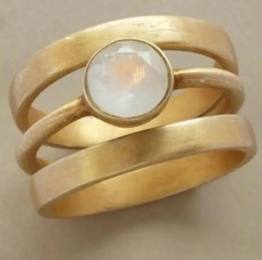 Gold-plated geometric ring with hollow design and white chalcedony stone on titanium steel band
