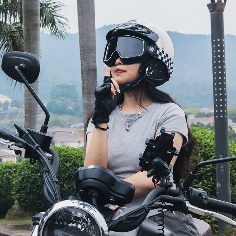 Retro full-face motorcycle helmet on a plain background, shown in cement grey colour.