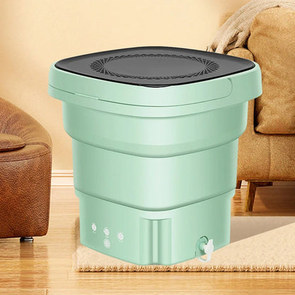 Green portable folding washing machine showing collapsed storage size and antibacterial blue light feature
