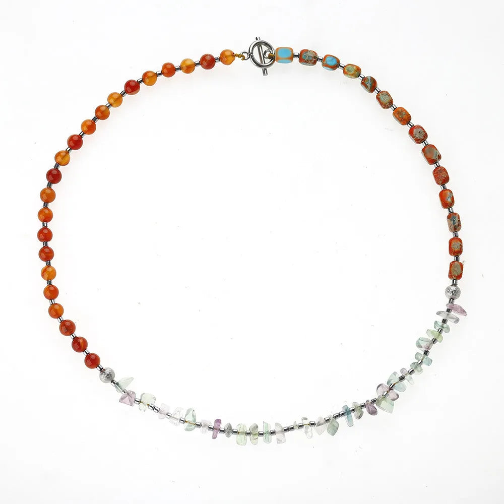 Hand-woven red agate round beads bracelet with geometric shapes and textured surfaces
