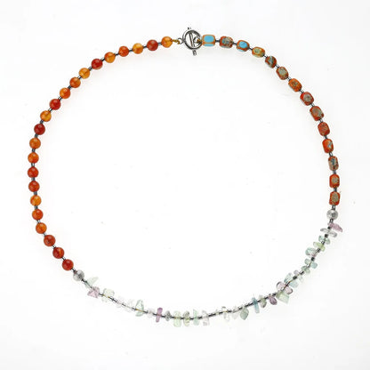 Hand-woven red agate round beads bracelet with geometric shapes and textured surfaces