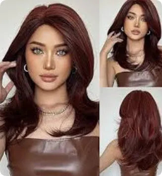 Mid-length curly synthetic wig with long bangs in a platinum gradient colour, shown on a wig stand.