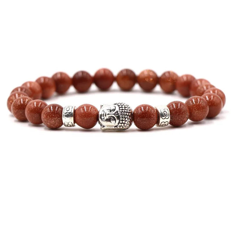 Natural stone stretch bracelet with round beads in various colours including Tigereye and turquoise.