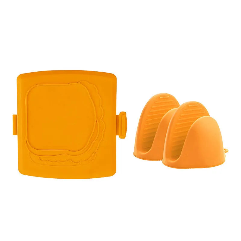 Red silicone baking tray with handbag-shaped mould and matching heat-resistant gloves on kitchen counter