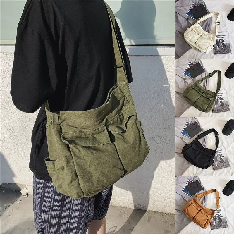 Canvas messenger bag in black, white, green, and brown with multiple pockets and adjustable strap