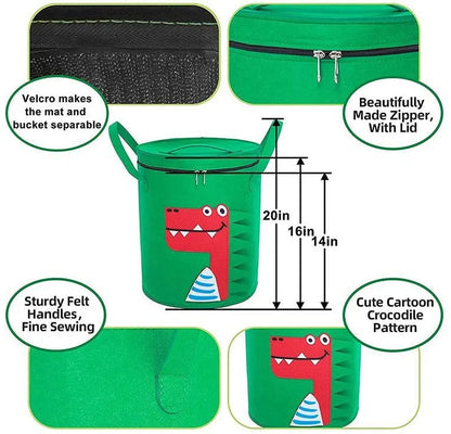 Green felt storage cube with pull rope unfolded into a large square play mat on a wooden floor.