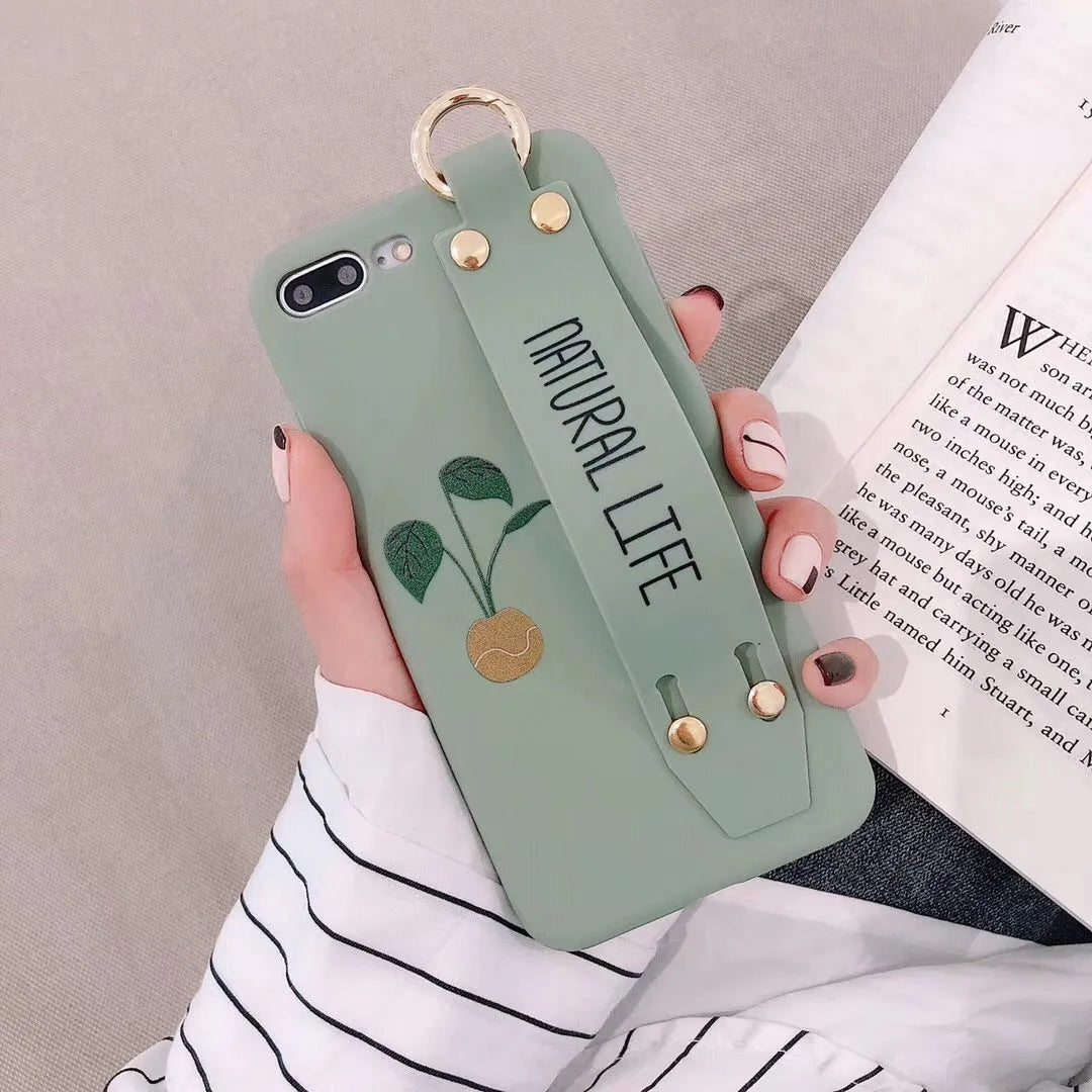 Green graffiti pattern wristband holder phone case for iPhone showing integrated wrist strap and back cover design