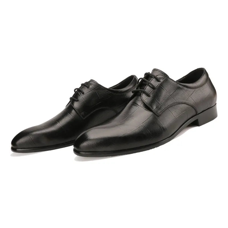 Men's black leather derby shoes with pointed toe, visible sewing details, and antiskid rubber soles