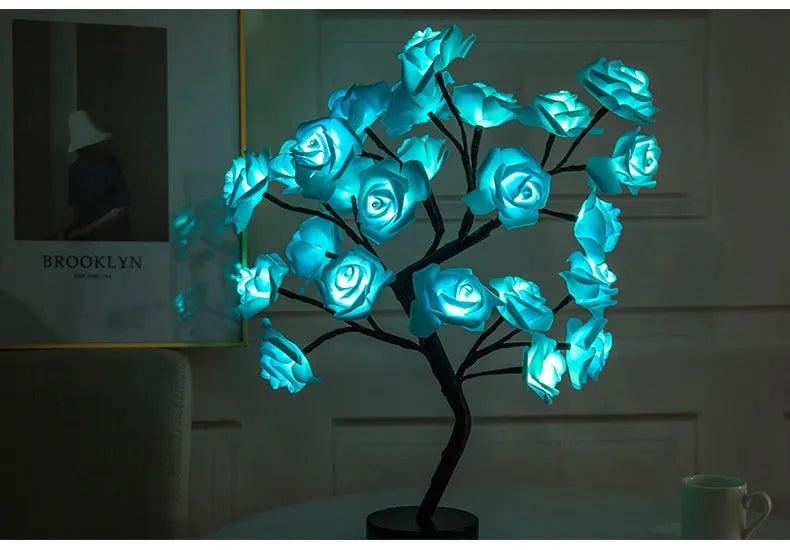 White and red rose flower LED lamp on a bonsai tree stand with warm white lights.