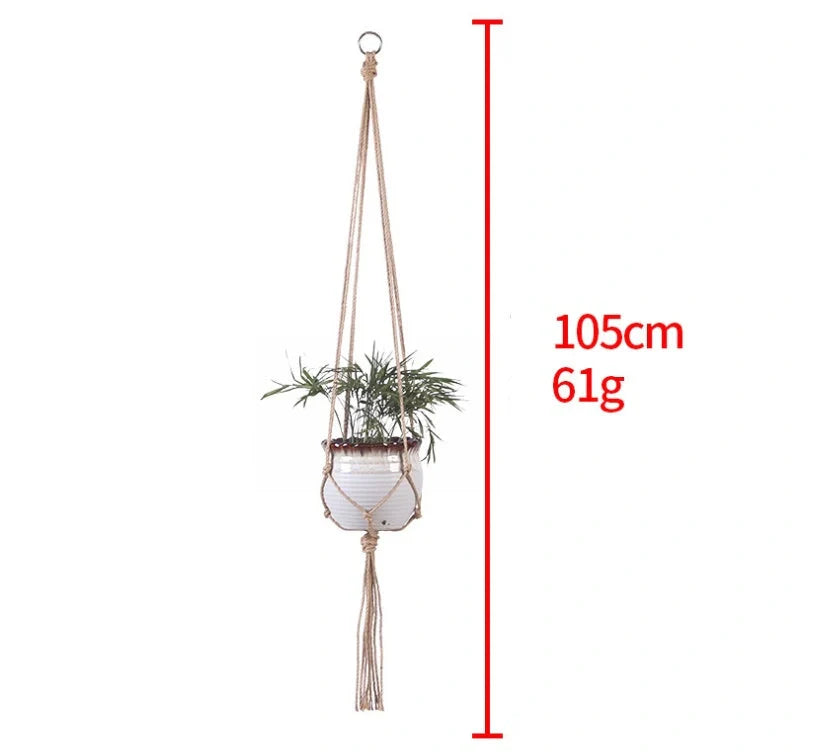 Hand-woven cotton rope hanging plant basket in natural jute, perfect for home decor.