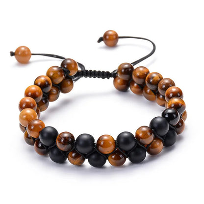 Tiger Eye and black agate geometric couple bracelets laid out as a matching set.