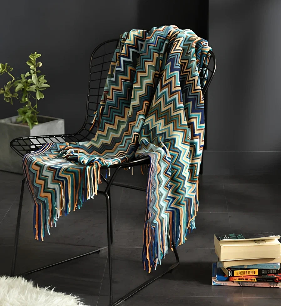 130x150cm knitted acrylic blanket with 10cm fringe detailing in beige colour draped over sofa