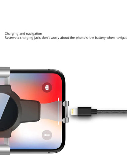 Black S4 ABS gravity mobile phone holder clipped onto a car air conditioning vent.