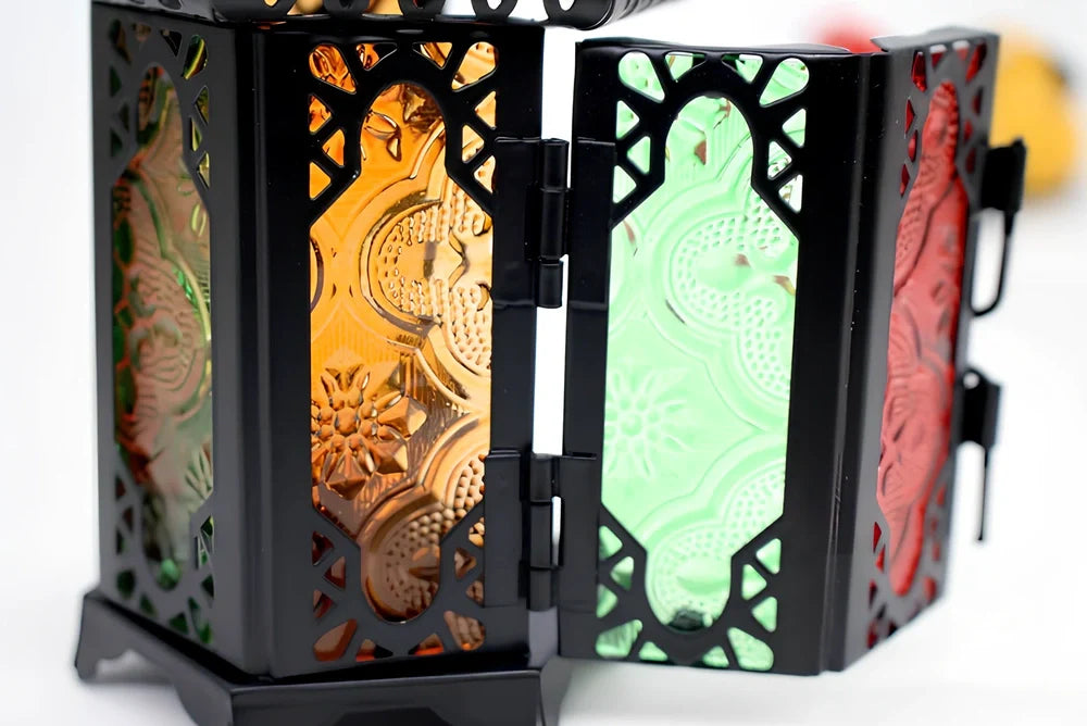 Wrought iron candle holder with 16cm height and 7cm diameter in black finish showing hanging design