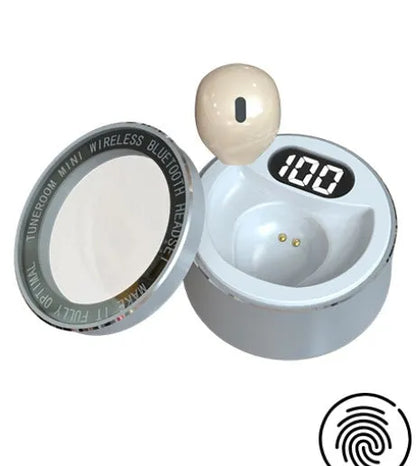 Invisible mini in-ear Bluetooth headset with 9mm discreet design in skin tone colour showing flush ear fit