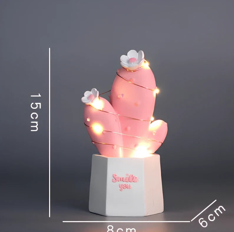 Cactus-shaped resin night light in gold finish measuring 15cm tall with warm LED glow