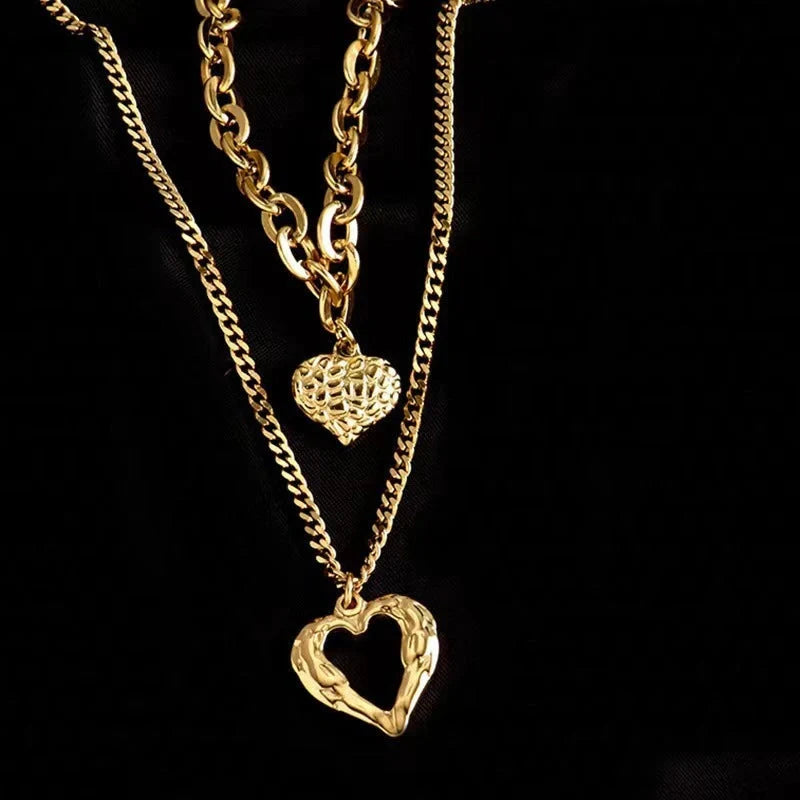 Stylish Titanium Steel Angel Wings Heart Necklace for Women in silver and golden finishes.