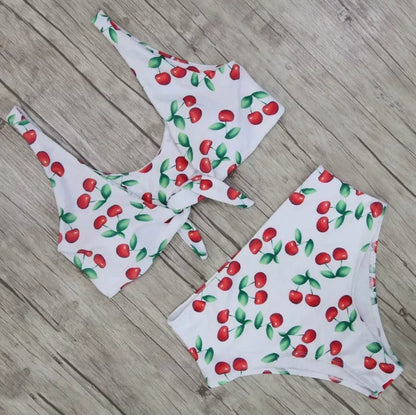 Double-sided knotted bikini swimsuit in yellow, orchid, and white floral patterns