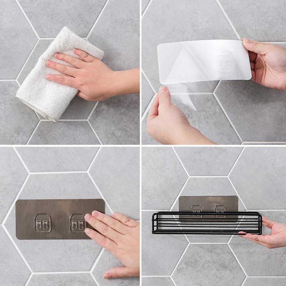 Black wrought iron bathroom shelf, 60cm long with drainage holes, holding shampoo bottles over tub edge